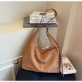 Detail of a large brown suede Hobo bag with adjustable metal buckle on dark cushion - Khaki