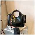 Black glossy pleated leather bucket bag with gold hardware and tassel charm - With Charm / Black