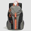 Detail of grey and black nylon travel backpack with vibrant orange zippers and mesh side pocket - Gray
