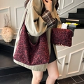 Burgundy leopard print tote bag with small pouch set shown on model in khaki coat - Red