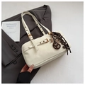 Close-up of creamy white shoulder bag featuring premium leather texture and gold hardware details - With Pendant / Off White