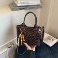 Leopard print bucket bag with brown trim and colorful wooden bead charm detail - With Pendant / Coffee