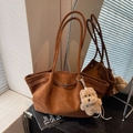 Brown suede bucket tote bag with long shoulder straps and a cute dog plush pendant - Yellow Brown With Pendant