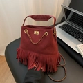 Burgundy bucket bag featuring quilted rhombic patterns and long fluid tassels - Red