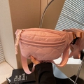 Pink quilted canvas waist bag with adjustable strap and orange brand label detail - Pink