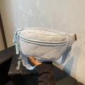 Light blue quilted canvas waist bag with adjustable strap and orange brand label - Blue