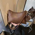Dark brown faux leather crossbody bag with ethnic woven strap and plush ball charm - Brown (With Charm)