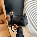 Black leather dumpling bag with colorful woven strap and brown pompom charm detail - Black (with Pendant)