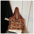 Ethnic knit tote bag in dark brown with colorful tassels and bohemian fringe details - Brown