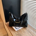 Black glossy patent leather tote bag with elegant gold hardware and dual shoulder straps - Black