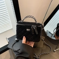 Quilted black velvet vanity box bag with silver chain strap and metal lock detail - Black
