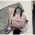 Stylish light purple nylon crossbody bag with woven handle and wide shoulder strap - Pink Small