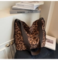 Detail of leopard print canvas tote bag featuring nylon straps and side storage pocket - Light Brown