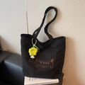 Black corduroy tote bag featuring brown dachshund embroidery and yellow flower charm - With Charm Style / Black with Pendant