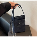 Detail of a dark blue denim crossbody phone bag with metal buckle and shoulder strap - Style 1 / Dark Blue