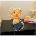 Detail of cute plush bear bag showing sunflower hat and soft teddy fur textures - Beige