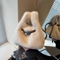 Furry cream white faux fur bucket bag with brown leather strap and metal buckle - Off-white