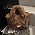 Brown teddy fleece bucket bag with plush texture, silver bead chain and white woven label - Brown