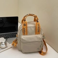Mini bolso bandolera de nailon beige con correas jacquard naranjas y bolsillo con cremallera - Crema y Marrón