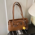 Vintage brown leather underarm bag with belt buckle and decorative plush pom-poms - Brown with Pendant