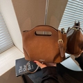 Brown faux suede bucket bag with cut-out handle and adjustable leather strap - Brown