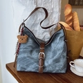 Blue washed denim tote bag with brown leather straps and a plush bear pendant - Denim Blue With Pendant