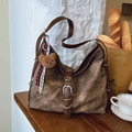 Vintage brown canvas tote bag with leather straps and cute bear charm in a cafe setting - Denim Brown (With Pendant)