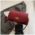 Detail of burgundy faux suede and patent leather handbag with golden twist lock - Burgundy
