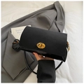 Detail of black suede and leather patchwork bag with golden oval twist lock - Black