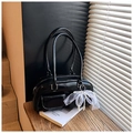 Detail of black glossy leather bag featuring white lace bow and faux pearl accents - Black PU Leather (With Charm)