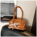 Detail of caramel leather Boston bag with white lace bow and pearl charm ornament - Brown PU Leather (With Charm)