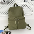 Olive green minimalist nylon backpack with dual front pockets for students and daily commute - Green