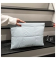 Detailed view of light blue quilted laptop clutch featuring soft waterproof nylon texture - Blue