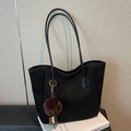 Black matte tote bag with thin shoulder straps and a decorative plush charm with beads - With Charm / Black