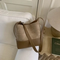 Brown patchwork bucket bag with suede and leather texture, featuring adjustable strap - Khaki