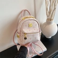 Pink embossed mini backpack with golden logo and side rivets in a vintage aesthetic - Pink Small