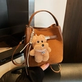 Brown nubuck leather bucket bag with top handle and cute plush dog charm accessory - With Pendant / Brown