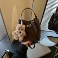 Dark brown suede bucket bag with silver hardware and a cute puppy plush charm - With Pendant / Brown