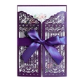 Detail of laser-cut purple invitation gate with satin ribbon and floral inner card - Deep purple