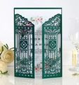 Detail of laser-cut gatefold wedding invitation in dark green with floral inner card - Dark Green