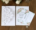 Elegant white laser-cut floral wedding invitation set with pink floral card on wood - White