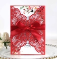 Detailed laser-cut red wedding invitation with floral insert and elegant ribbon bow - Pearlescent Red