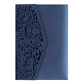 Close-up of laser-cut navy blue wedding invitation with intricate floral hollow pattern - Magic Blue