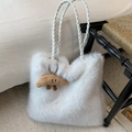Detail of white fluffy tote bag with woven leather handles and cute croissant pendant - White with Pendant