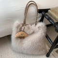 Detail of beige faux fur tote bag with brown woven handle and croissant plush charm - Khaki With Pendant