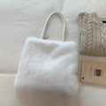 White faux fur tote bag with braided handles in a cozy winter lifestyle aesthetic - White Without Pendant