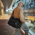 Black multi-pocket canvas messenger bag with NOCOBAG logo and brown shoulder strap - Black