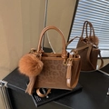 Brown leopard print bucket bag with plush charm and adjustable shoulder strap - Style With Charm / Brown
