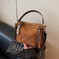 Retro brown suede Boston bag featuring quilted orange stitching and gold hardware - Brown