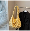 Detail of bright yellow plush tote bag featuring a textured 3D checkered pattern - Yellow